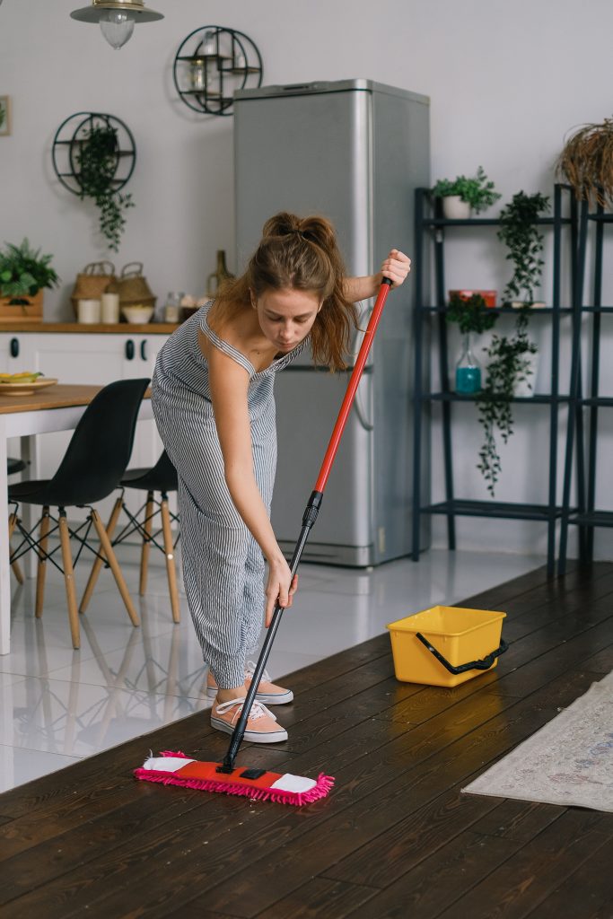 girl mopping bamboo floor